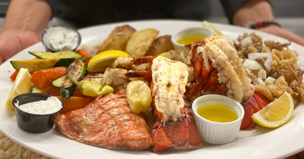 A La Casa Ouzeria feast showcasing Greek tradition, Italian comfort, and generous hospitality